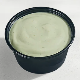 Menu 220 Avocado Ranch Sauce, served in a Taco Bell-branded container.