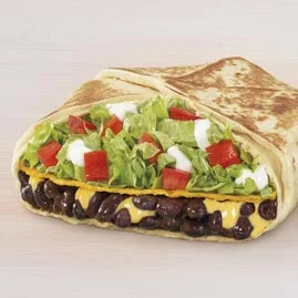 Menu 146 A Black Bean Crunchwrap Supreme®, filled with black beans, Nacho Cheese sauce, a tostada shell, lettuce, diced tomatoes, and reduced-fat sour cream folded into Crunchwrap form.