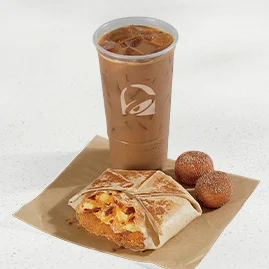 Menu 62 A Breakfast Crunchwrap Combo featuring a Breakfast Crunchwrap Bacon, Cinnabon Delights® 2 Pack, and a medium fountain drink.