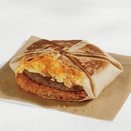 Menu 3 A Breakfast Crunchwrap Sausage, filled with a hash brown, fluffy cage-free eggs, sausage, Jalapeño sauce, and shredded cheddar cheese, all folded into a Crunchwrap form.