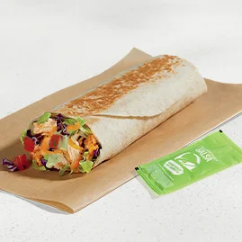 Menu 117 A Cantina Chicken Burrito, served with an Avocado Verde Salsa packet.