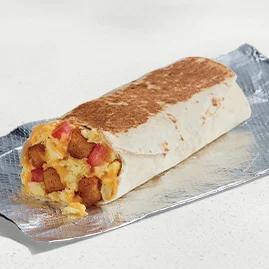 Menu 50 A Cheesy Toasted Breakfast Burrito Potato, filled with seasoned potatoes, fluffy eggs, and nacho cheese sauce.