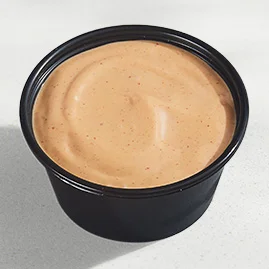 Menu 219 Chipotle Sauce, served in a Taco Bell-branded container.