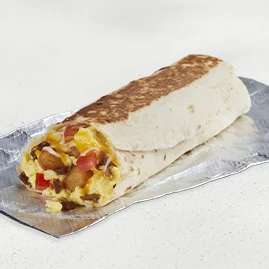 Menu 53 A Grande Toasted Breakfast Burrito Bacon, filled with bacon, seasoned potatoes, fluffy cage-free eggs, and diced tomatoes.