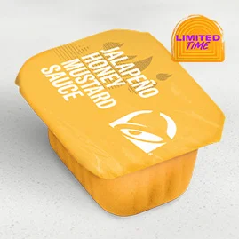 Menu 200 Jalapeño Honey Mustard Dip Sauce, served in a Taco Bell-branded container.