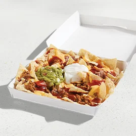 Menu 102 A Loaded Beef Nachos box, filled with crispy tortilla chips topped with seasoned beef, refried beans, Nacho Cheese Sauce, Red Sauce, guacamole, and reduced-fat sour cream.