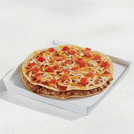 Menu 143 A Mexican Pizza on a white paperboard box, showing two crispy flour tortillas layered with seasoned beef, refried beans, Mexican Pizza sauce, diced tomatoes, and a blend of cheeses