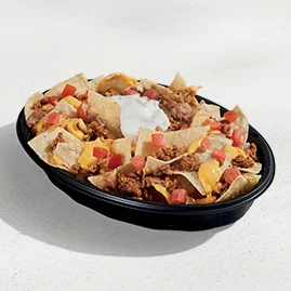Menu 8 A Nachos Bellgrande® tray with tortilla chips topped with seasoned beef, nacho cheese sauce, refried beans, diced tomatoes, and reduced-fat sour cream.