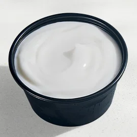 Menu 216 Reduced-Fat Sour Cream, served in a Taco Bell-branded container.
