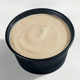 Menu 221 Spicy Ranch sauce, served in a Taco Bell-branded container.