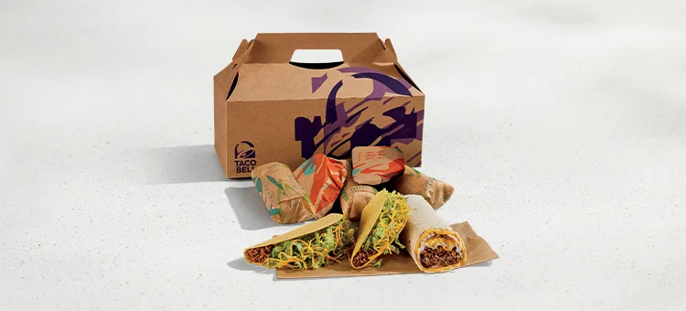 Menu 256 Taco & Burrito Cravings Pack, featuring 4 Crunchy Tacos and 4 Beefy 5-Layer Burritos placed in front of a Taco Bell-branded box.