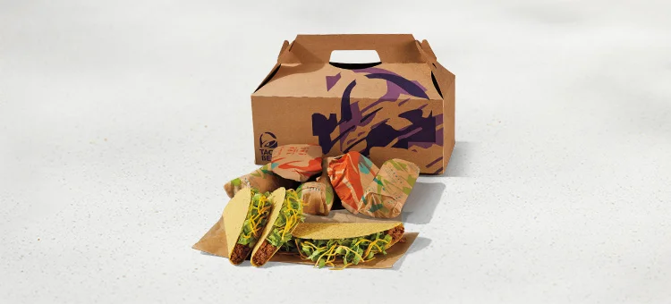 Menu 257 A Taco Party Pack includes 3 crunchy tacos and five items wrapped in Taco Bell-branded paper, placed in front of a Taco Bell-branded box.
