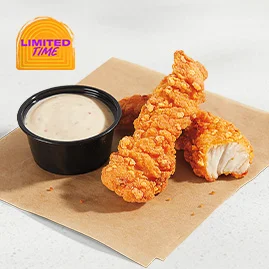 Crispy Chicken Strips featuring two tortilla chip-breaded chicken strips marinated in bold Mexican spices, served with Spicy Ranch sauce.