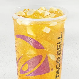 Mango Peach Agua Fresca with freeze‑dried mango pieces, green tea base and ice in a clear cup
