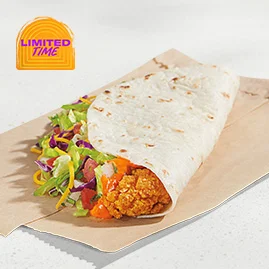 Spicy Ranchero Crispy Chicken Taco with crunchy chicken, cheddar, pico, lettuce, cabbage, and ranchero sauce in a crisp taco shell