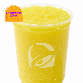Menu 13 Pineapple Freeze blended with real pineapple flavor and crushed ice, served as a smooth, refreshing frozen beverage in a Taco Bell cup.